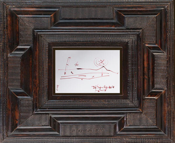 The paper card JA.SIGNATURE N°10 by james Arax staged in an ancient frame.