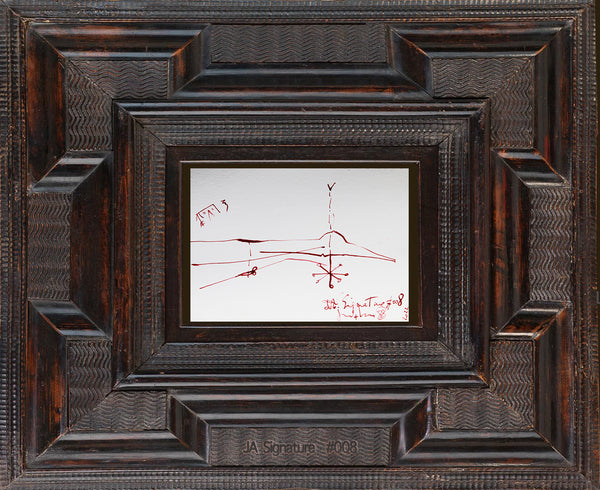 The paper card JA.SIGNATURE N°8 by james arax staged in an ancient frame.